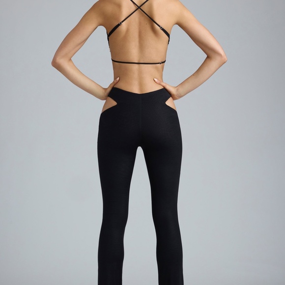 Oh Polly Metallic Cut-Out Low-Rise Flared Trousers in Black 4 - Picture 2 of 3